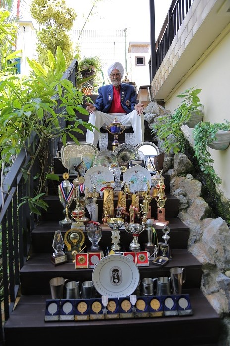 old sikh sitting on stairs